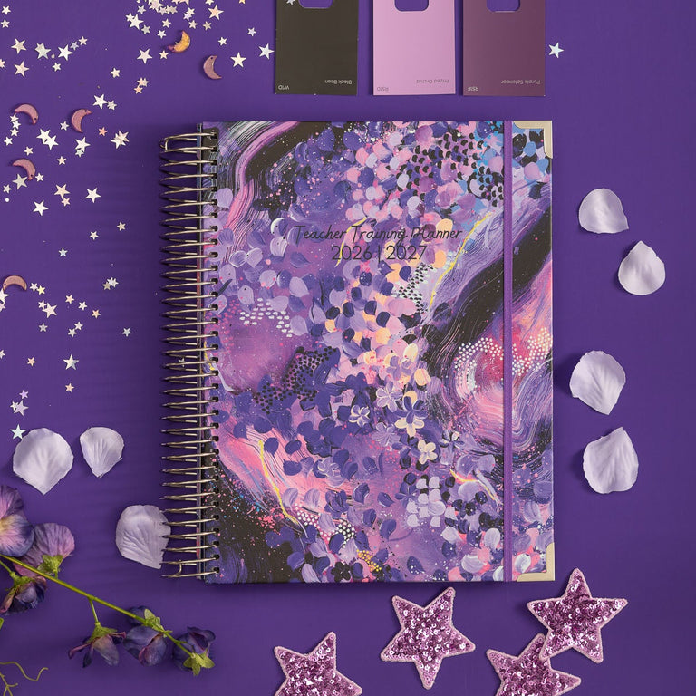 Purple notebook with decorative elements on a purple background