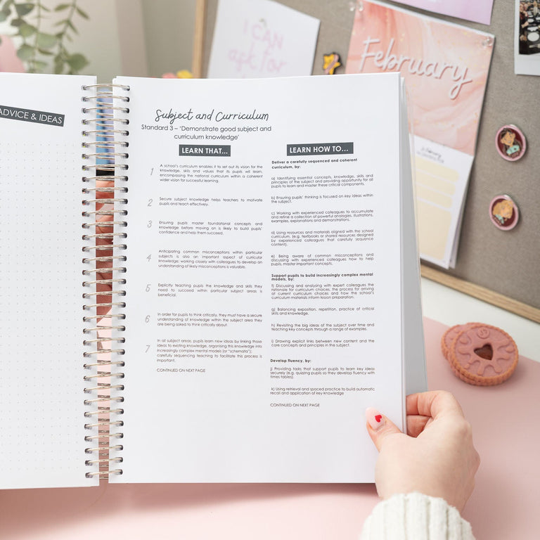 Person holding an open planner with a decorative background
