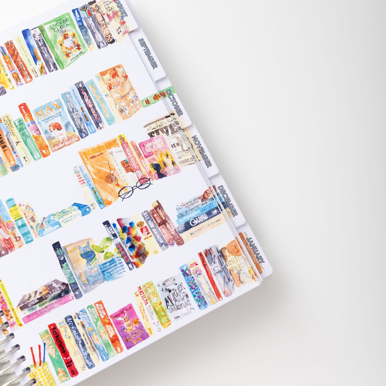 Colorful book spines arranged in a pattern on a white surface