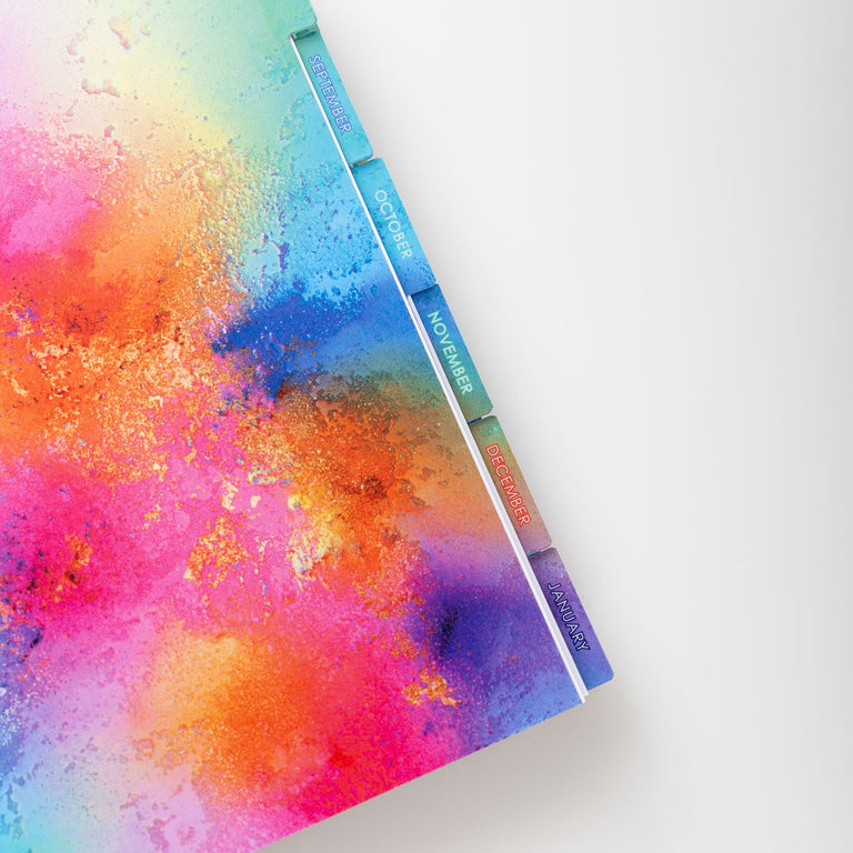 Colorful watercolor notebook on a white background