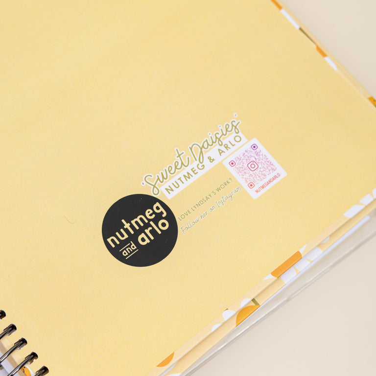 Yellow notebook with visible branding on a light background