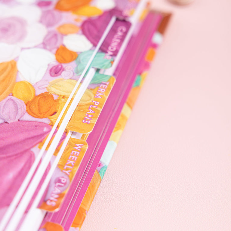 Colorful stationery set with a pink background