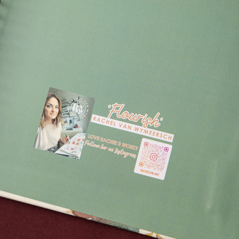 Green notebook with a visible brand logo on a brown surface